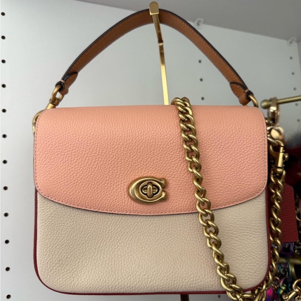 Coach Pink and Cream Crossbody Bag with Elegant Gold Hardware